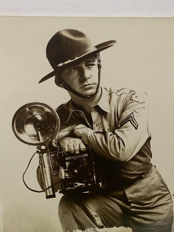 Vintage ww2 soldier photo holding speed graphic camera world war 2 photography