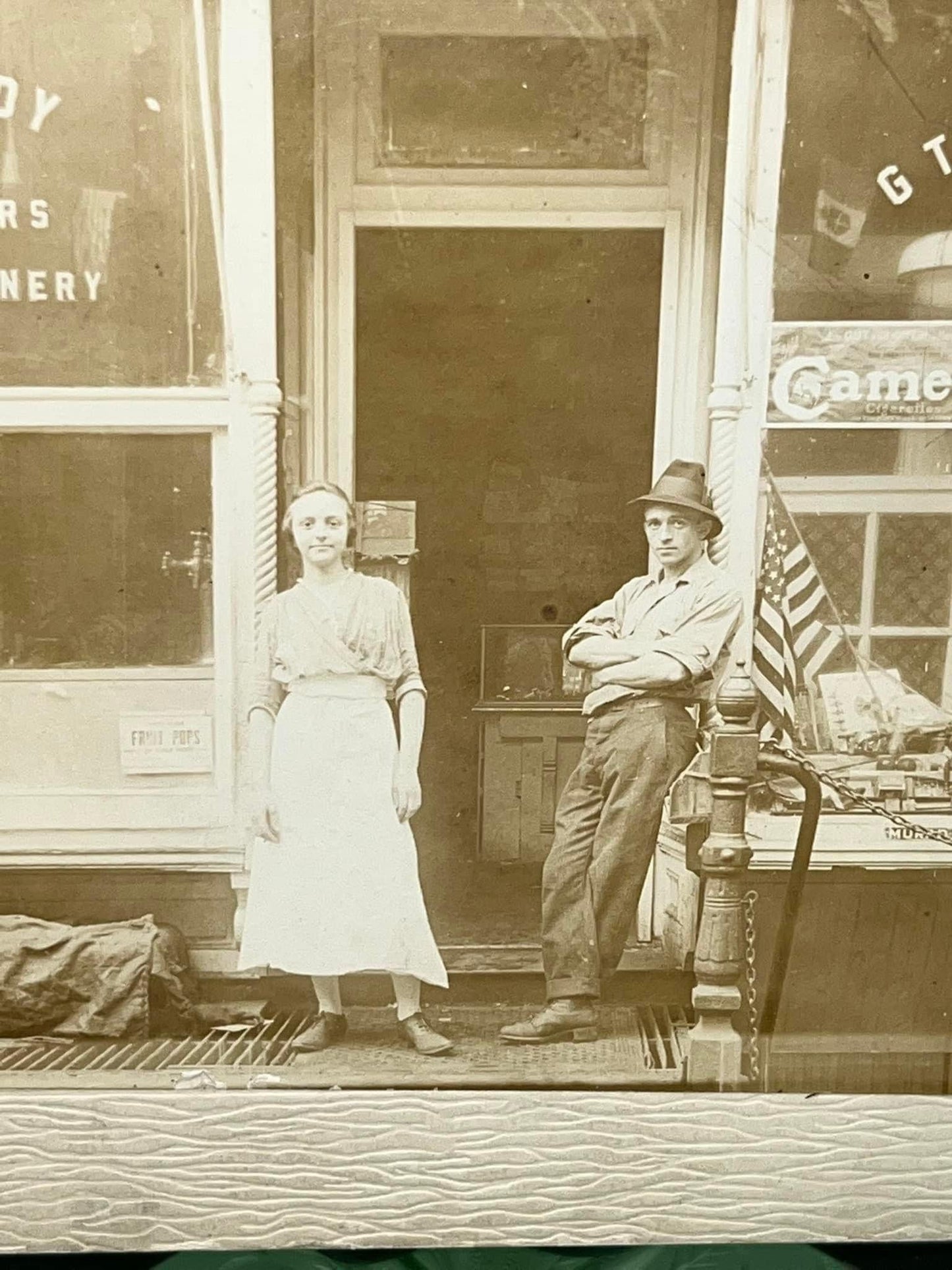 Antique mounted photo 1890s 1900s occupational Candy store & tobacco American flags in window camel advertising
