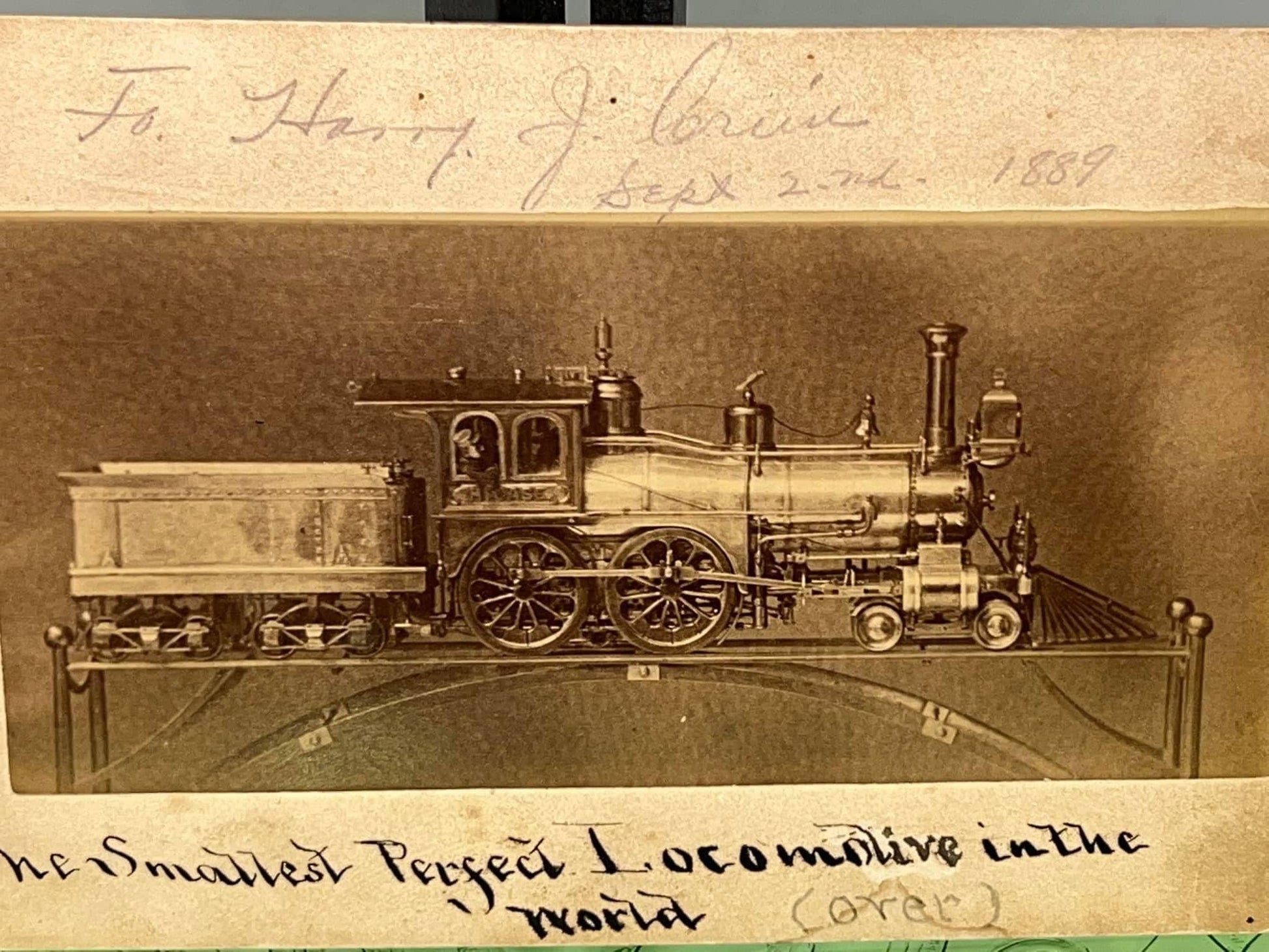 Antique mounted photo Smallest model locomotive in the world 1889 still life