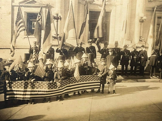 Antique Ww1 era photo Parade w children holding long American flag vintage photography 1910s