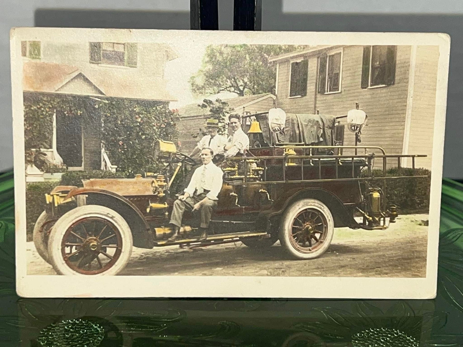 Antique real photo postcard firemen on fire truck hand tinted 1910s